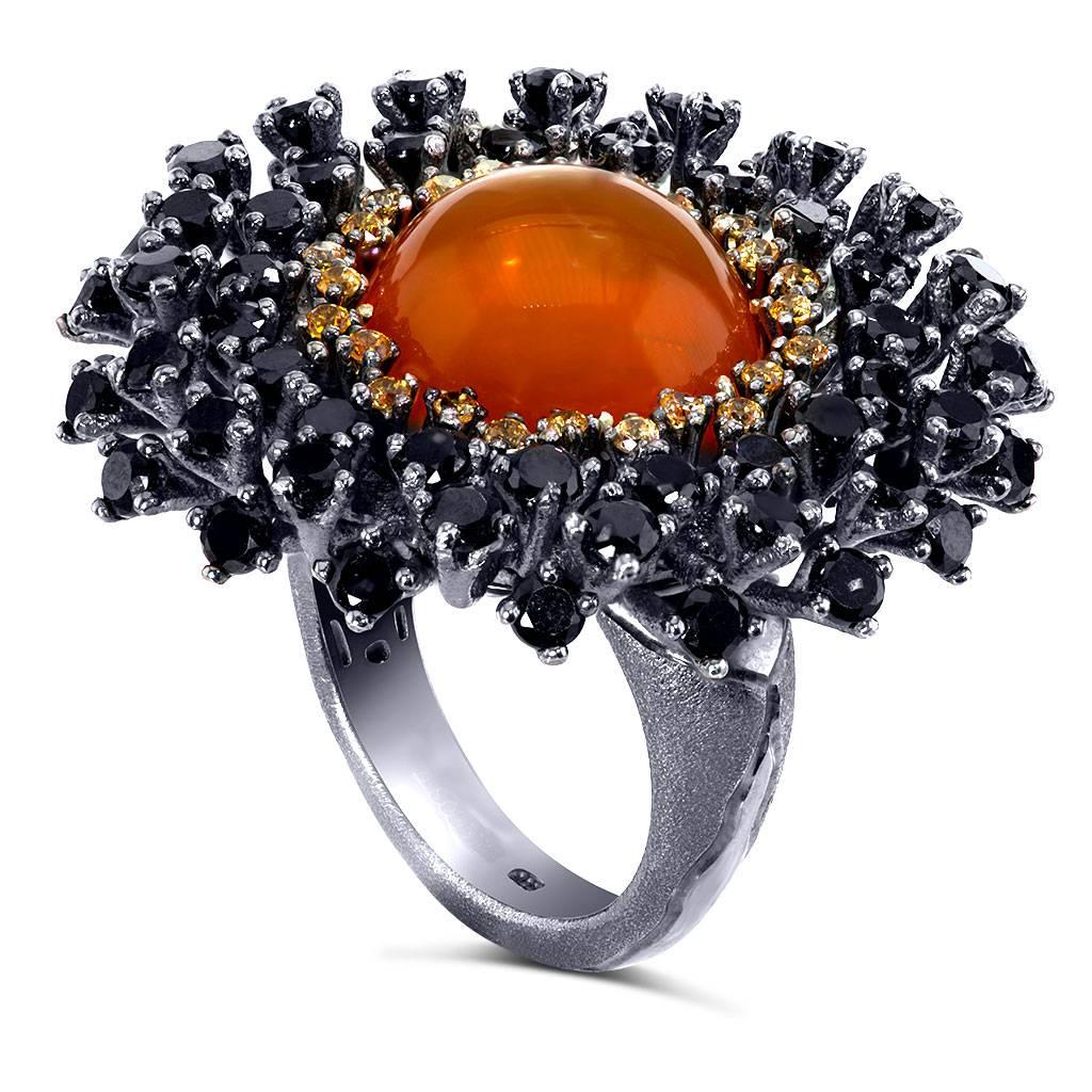Alex Soldier Fire Opal Astra ring features 15 carats of fire opal, 8.6 carats of black spinel and 0.6 carats of garnets. Made in sterling silver infused with dark platinum. Ring size: 9. Complimentary ring sizing is available within 2 business days.
