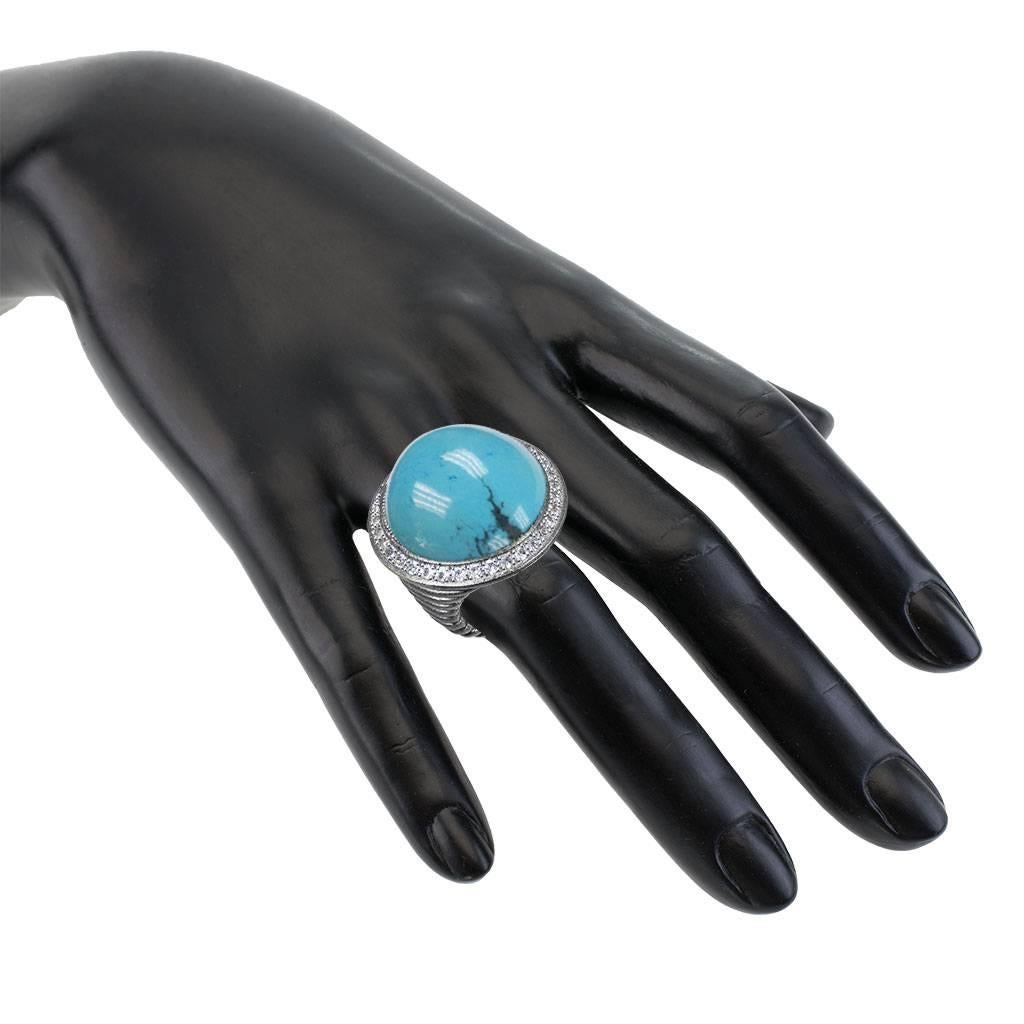 Alex Soldier Oxidized Silver Turquoise Ring w Diamonds. Inspired by the grandeur of antiquity, the Symbolica collection is enriched with meaning. The ring is made in oxidized silver with diamonds surrounding the hand-cut turquoise center. Center