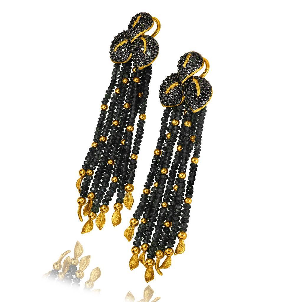 Alex Soldier Black Leaf Earrings are a stunning work of art made in 18 karat yellow gold with 56 carats of black spinel. The earrings feature 14 gold leafs, each individually hand textured under microscope with unparalleled character and precision.