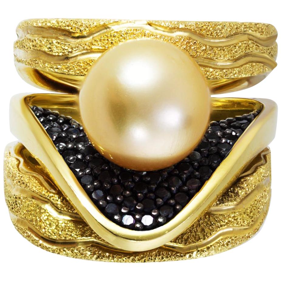 Trinity Pearl Ring by Alex Soldier: 18 karat yellow gold ring with 9 mm Akoya golden pearl, black diamonds (0.5 ct.) and signature metalwork that creates an illusion of inner sparkle. Handmade in NYC. One of a kind. Size: 6.5. Complimentary ring