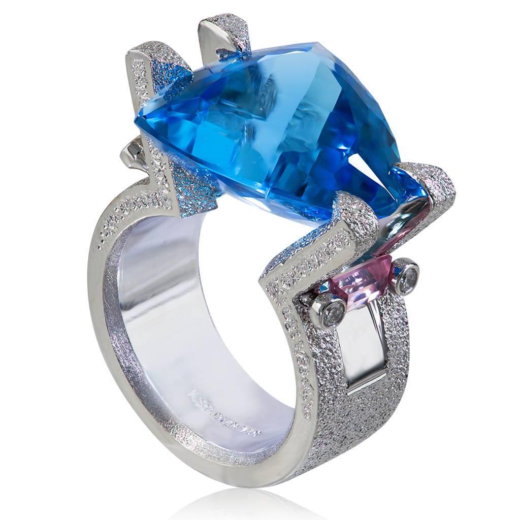 Alex Soldier Equilibrium ring in 18 karat white gold with trillion cut tension set blue topaz (12 ct), pink tourmaline (0.6 ct), and diamonds (0.1 ct). One of a kind. Handmade in NYC. Ring size: 6.25. Complimentary ring sizing is available within 2