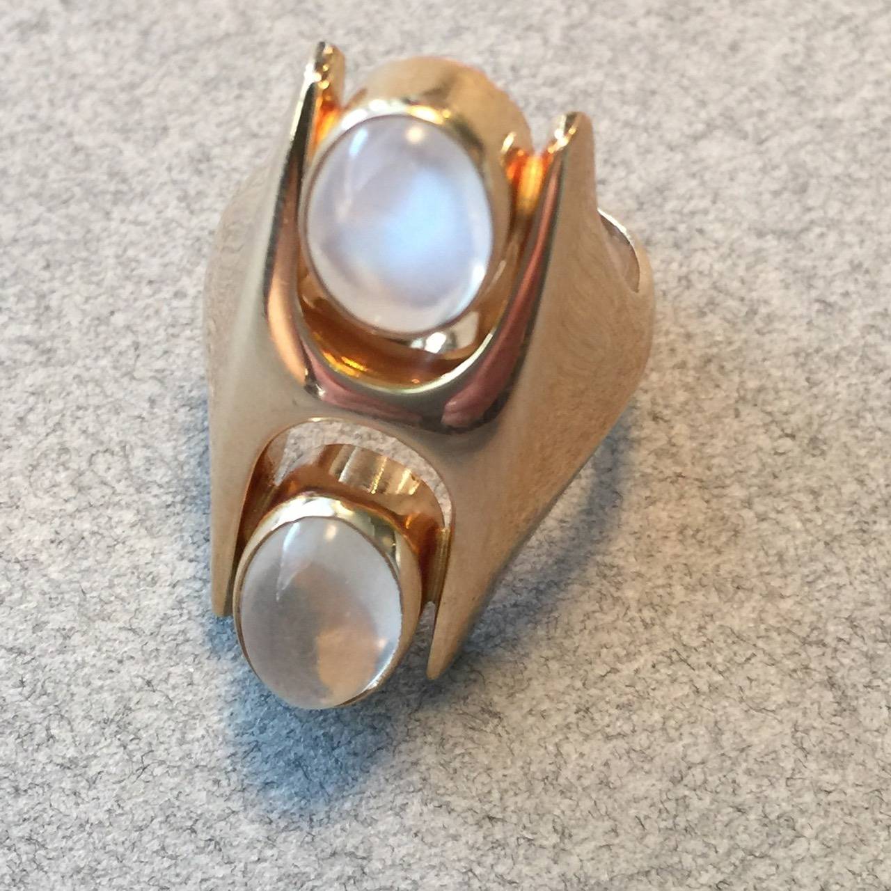 Georg Jensen Moonstone Gold Modernist Ring No. 845 by Henning Koppel 
Size 5.5
 
A similar example can be seen in the book Georg Jensen 