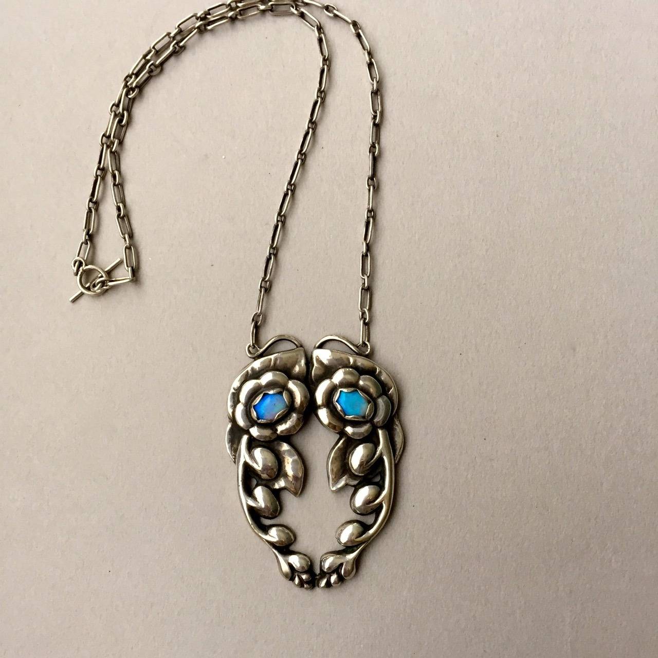 Georg Jensen Antique Sterling silver Opal pendant, no. 15 from 1912. 

Exceptional quality and condition.  Measures 2.25