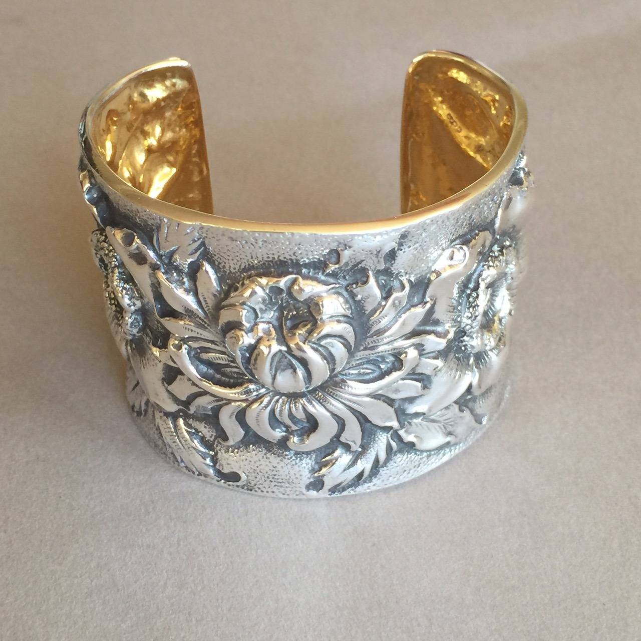 Sterling Silver "Repousse" Cuff Bracelet By Galmer.

Morning Bloom design by Galmer. Handcrafted in New York.

Contemporary production with Antique finish.

Repoussé is the intricate art which involves hammering a piece of metal