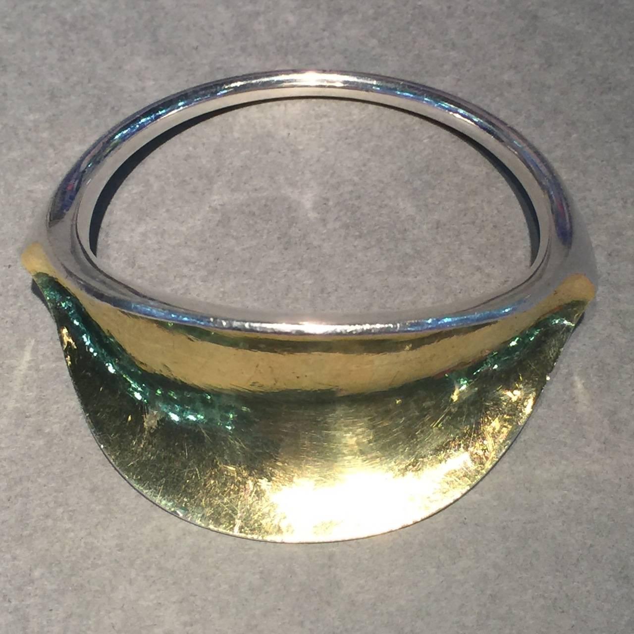 Hans Hansen Sterling Silver Modernist Bangle No. 251, Very Rare 

Stunning, hand wrought bangle with gilt interior. Very hard to find and a true conversation piece.

This bangle is heavy and in very good condition.

Weight is 84 grams / 3