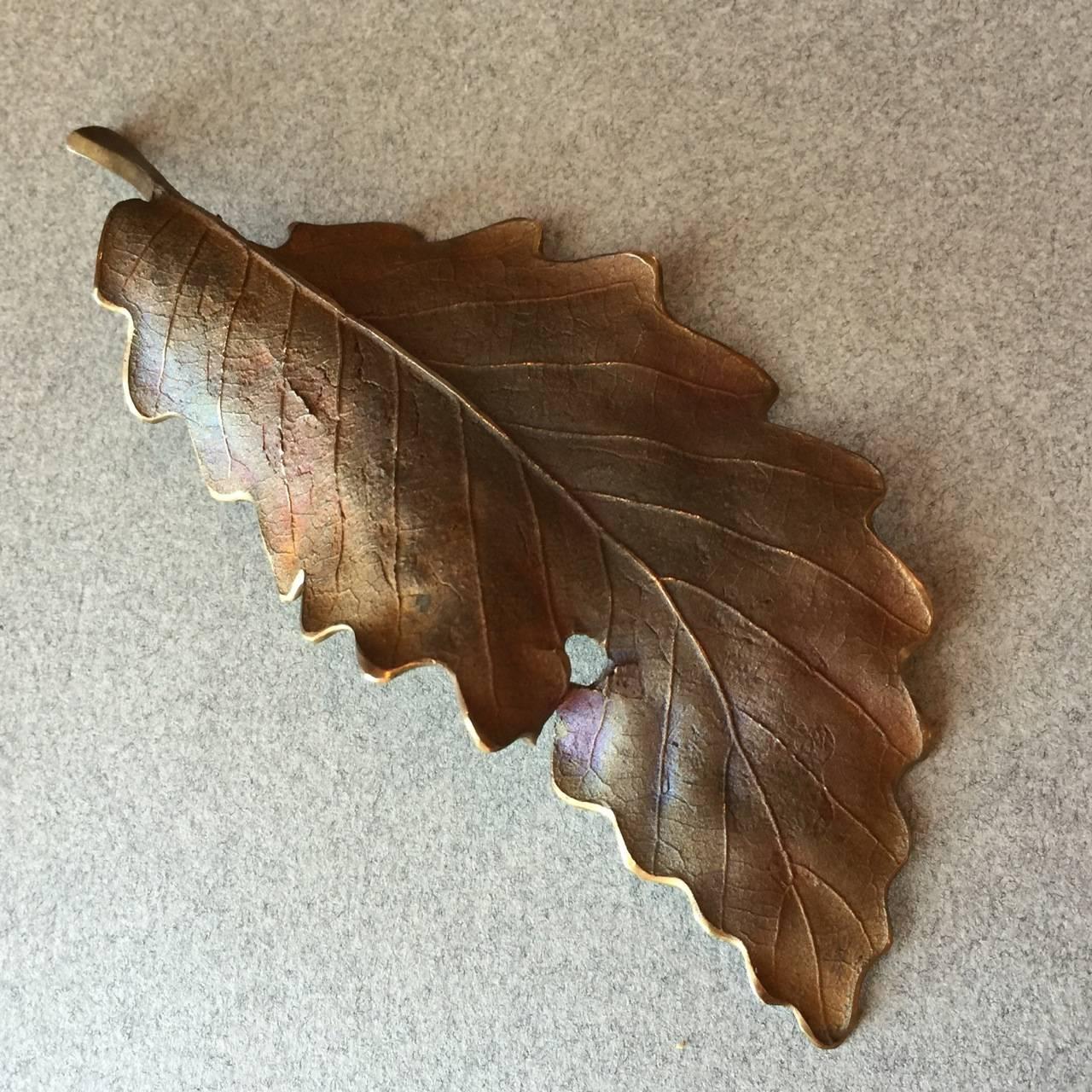 John Iversen Patinated Bronze Leaf Brooch 

This is one-of-a kind brooch from Iversen. Iversen used the Lost Wax technique on an actual leaf in order to preserve the patterns, surface, and personality in this amazing replica. 

Complimentary gift