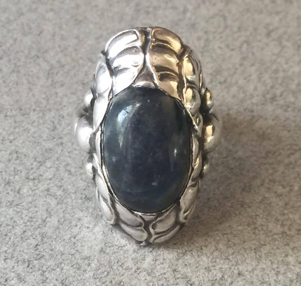 Georg Jensen Sterling Silver Ring No. 11 With Labradorite. A wonderful ring that is rare to find in this large size and with a Labradorite. The gem quality stone has a gorgeous iridescent quality and is surrounded by highly detailed sterling silver