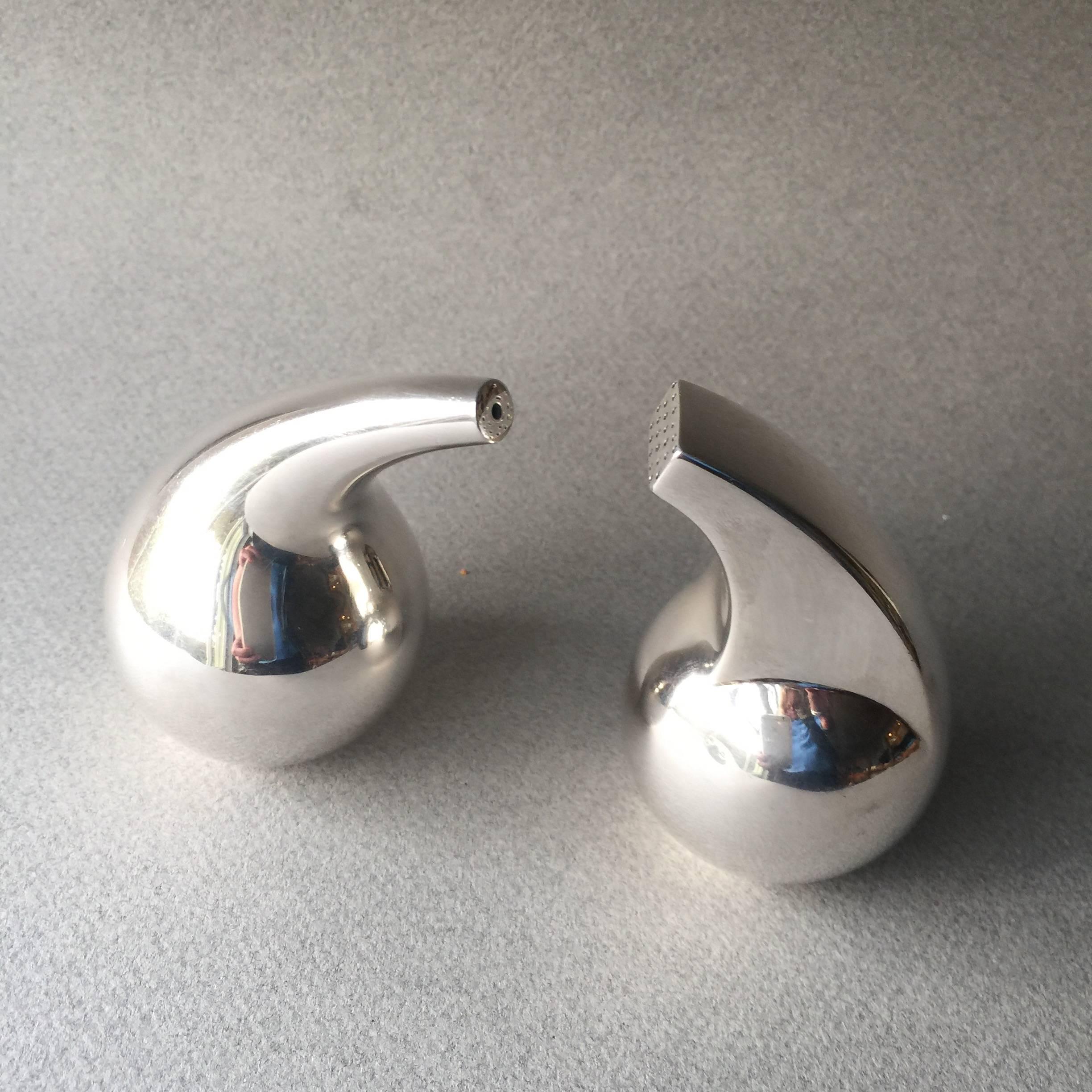 Sterling Silver Salt and Pepper No. 965 by Soren Georg Jensen.

Extremely modern designed in 1949.  Very modern pair for the era. 

A similar example can be seen in the book GEORG JENSEN HOLLOWARE, The Silver Fund Collection by David Taylor and