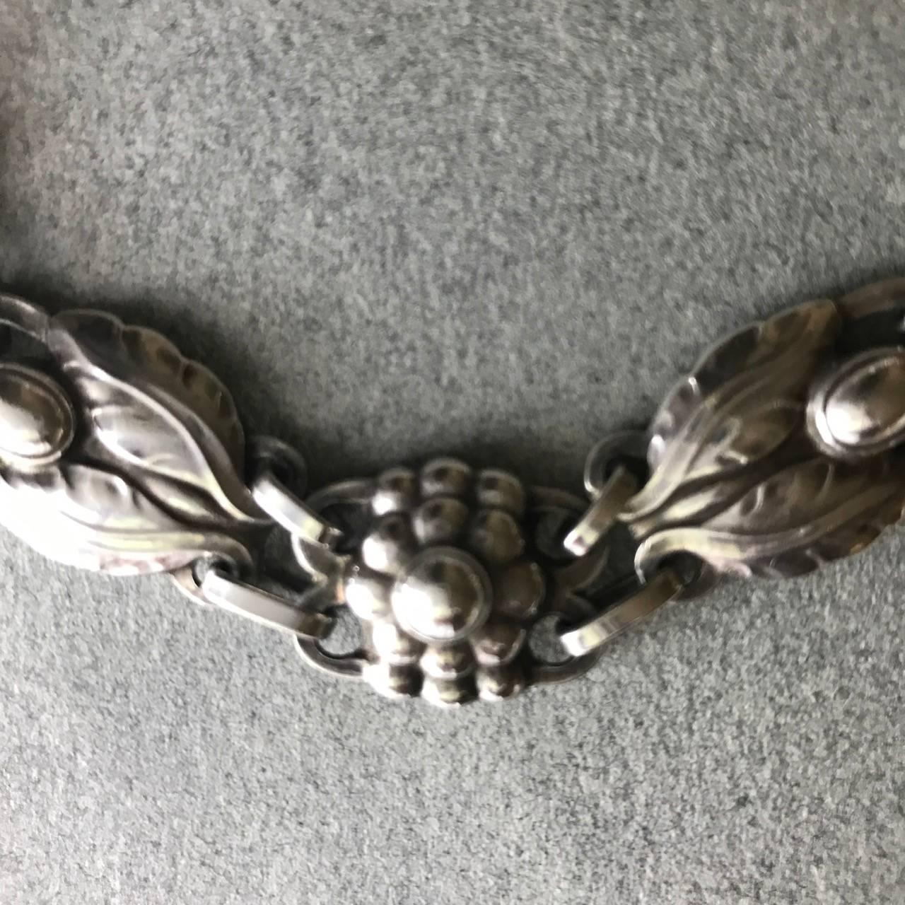 Georg Jensen Sterling Silver Necklace No. 1

Georg Jensen Sterling Silver Necklace No. 1.

 

This necklace is articulated beautifully so that it lays perfectly on the neck and breastbone. It is intricately detailed with stylized leaves and berries.
