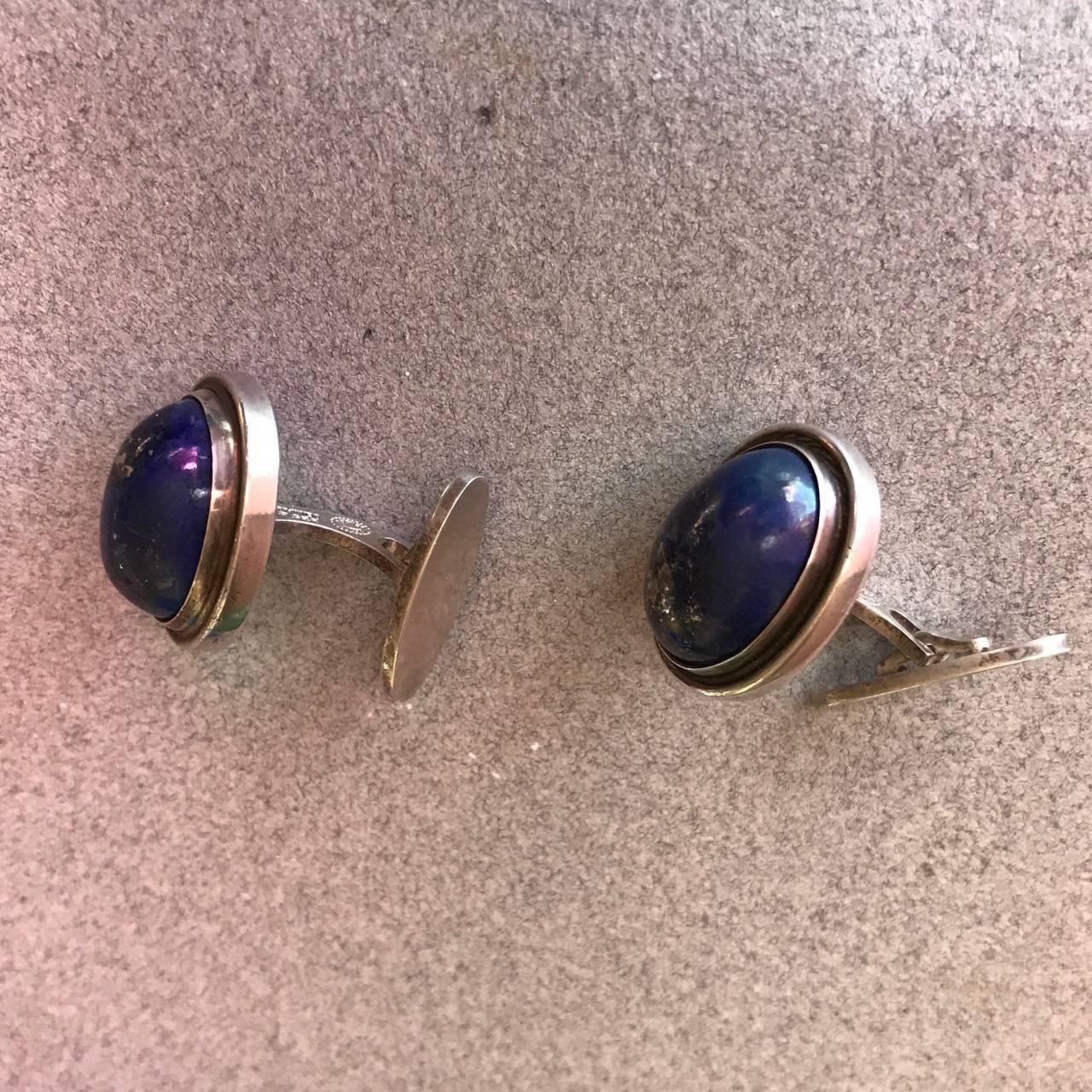 Georg Jensen Sterling Silver Cufflinks with Lapis Lazuli No. 44A by Harald Nielsen

Classically elegant, Art Deco design from the 1940s.  These large cufflinks are in excellent condition with vivid blue Lapis with pyrite flecks that catch the