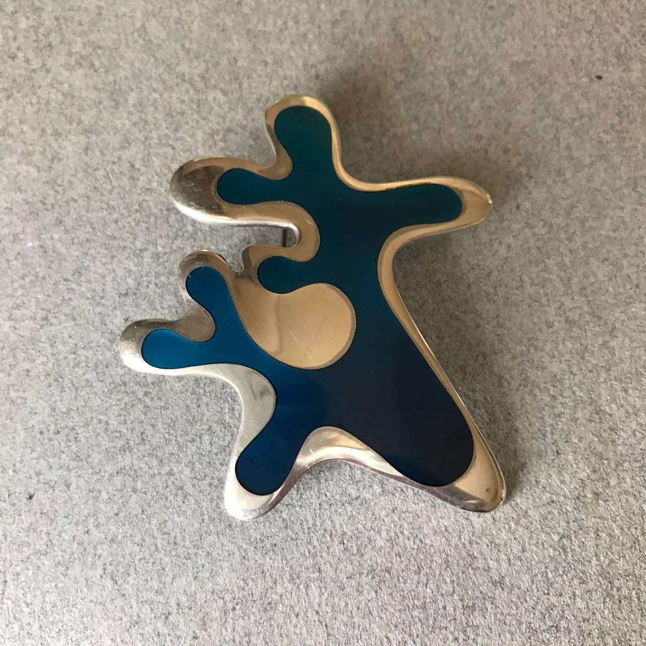 Rare Georg Jensen brooch No. 370 by Henning Koppel. 

This dramatic design is from 1948 and made in that period. Other enamel designs were produced in this genre but this is the rarest of all. 

Excellent condition with some light surface scratches.
