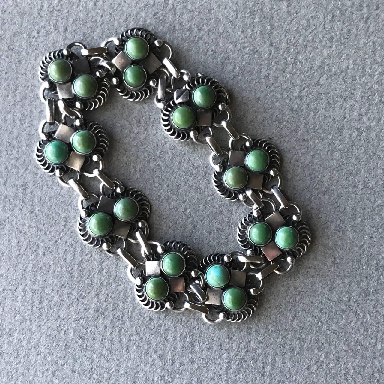 Georg Jensen Sterling Silver Bracelet No 8 with Turquoise cabochon stones, Very Rare.

Beautifully articulated with fine details in a classic art deco style.

Excellent condition. 

Hallmarks from 1933-44.

Complimentary gift box and FREE shipping