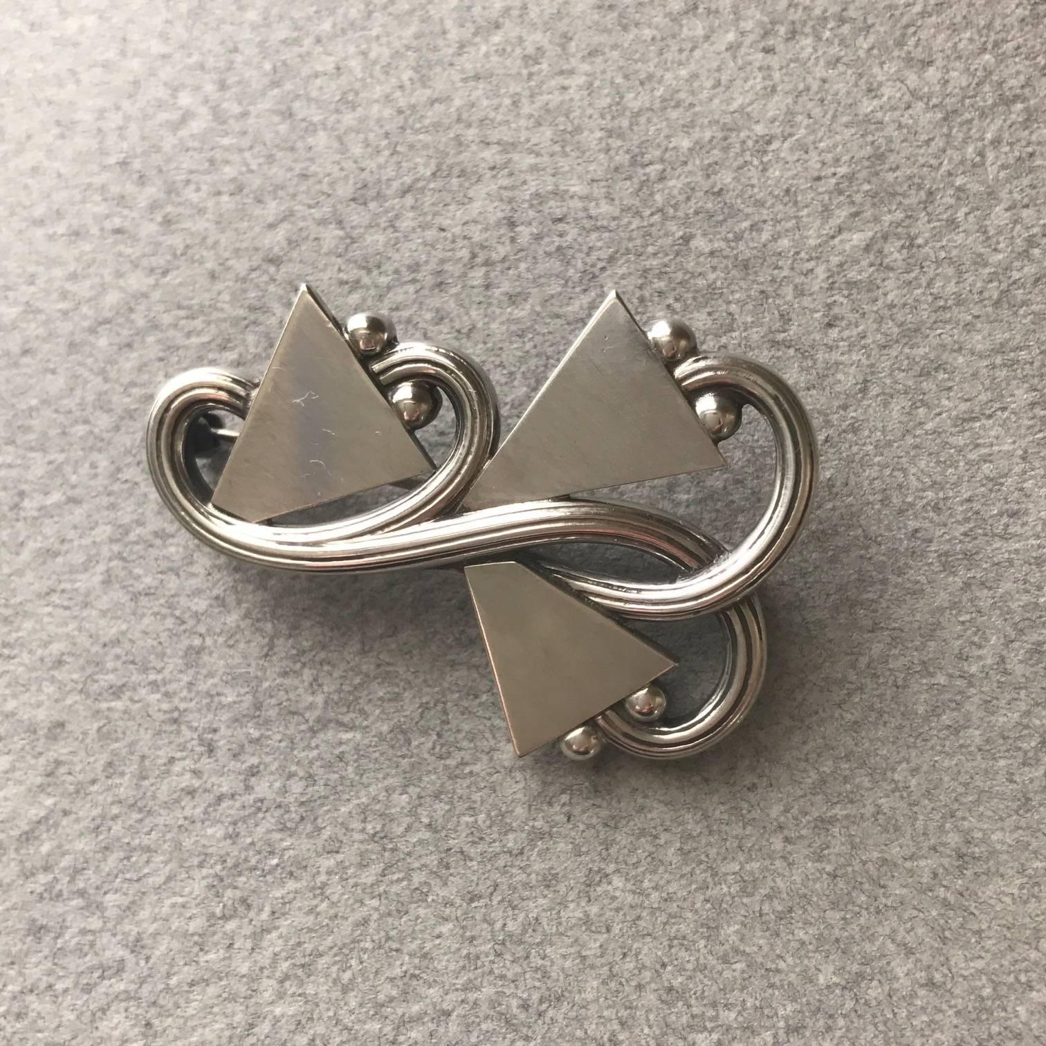 Georg Jensen Sterling Silver Brooch, No. 308

Unusual and hard to find, modernist piece by Georg Jensen's son, Jorgen Jensen.

First produced in 1953, out of production by the 1970's. An example is held in the collection of the British Museum.

An