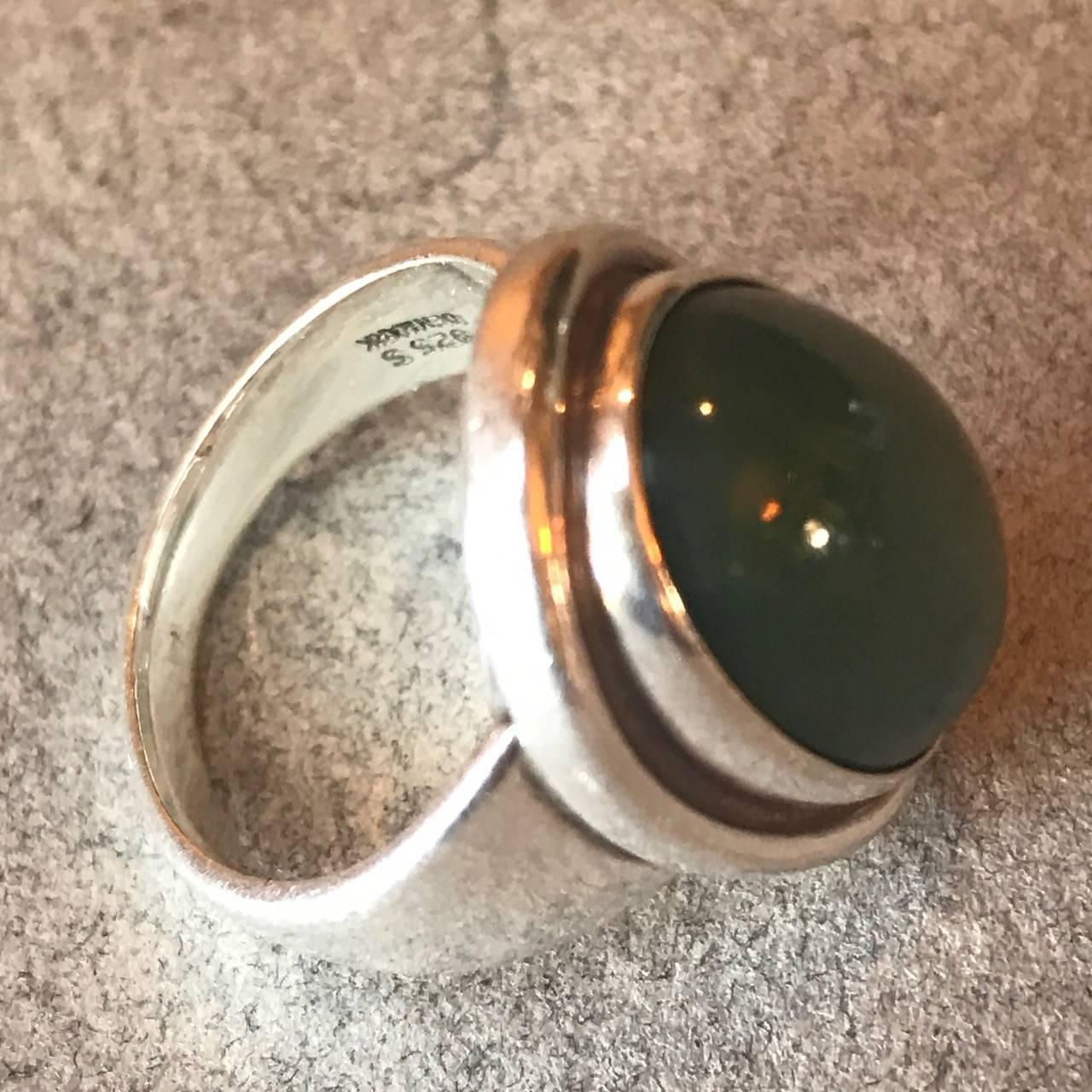 Georg Jensen Ring, no. 46A with Jadeite Cabochon Stone by Harald Nielsen

US ring size 7.

Can be resized. 

Complimentary gift box and FREE shipping included.

About the designer:
Harald Nielsen (1892-1977) is an important figure in the history of