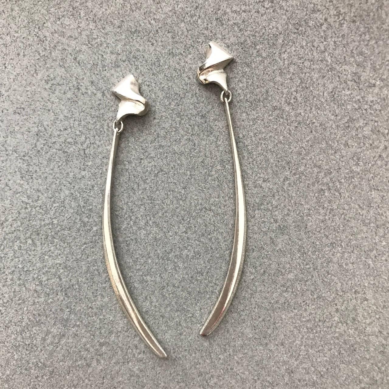 Lapponia Sterling Silver Pair of Earrings by Zolton Popovits.

Comes with original silvered fabric pouch.

Complimentary gift box included with purchase.