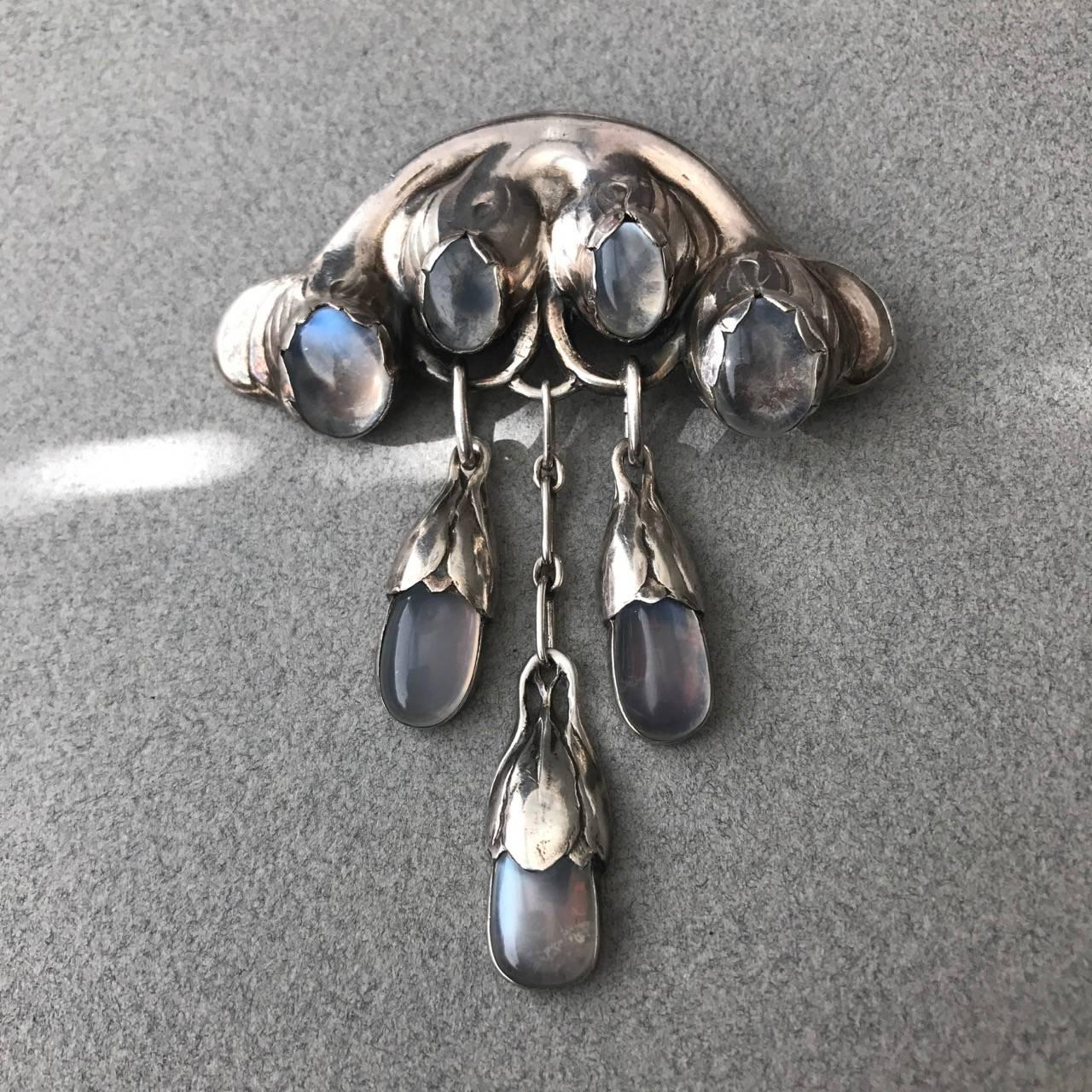 Evald Nielsen 830 Master Brooch with Moonstones
Complimentary gift box included with purchase.

An excellent example of a very large silver and moonstone master brooch by Evald Nielsen. Throughout his life Evald Nielsen was characterized by highly