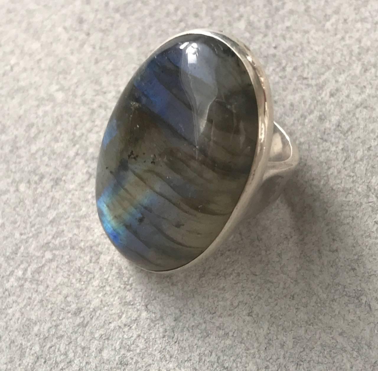 Georg Jensen Sterling Silver Ring No 90A With Labradorite.

A very rare example. Having English import marks.  Modernist design. Large attractive and luminous stone is mounted with an open back.

Complimentary gift box and FREE shipping included.