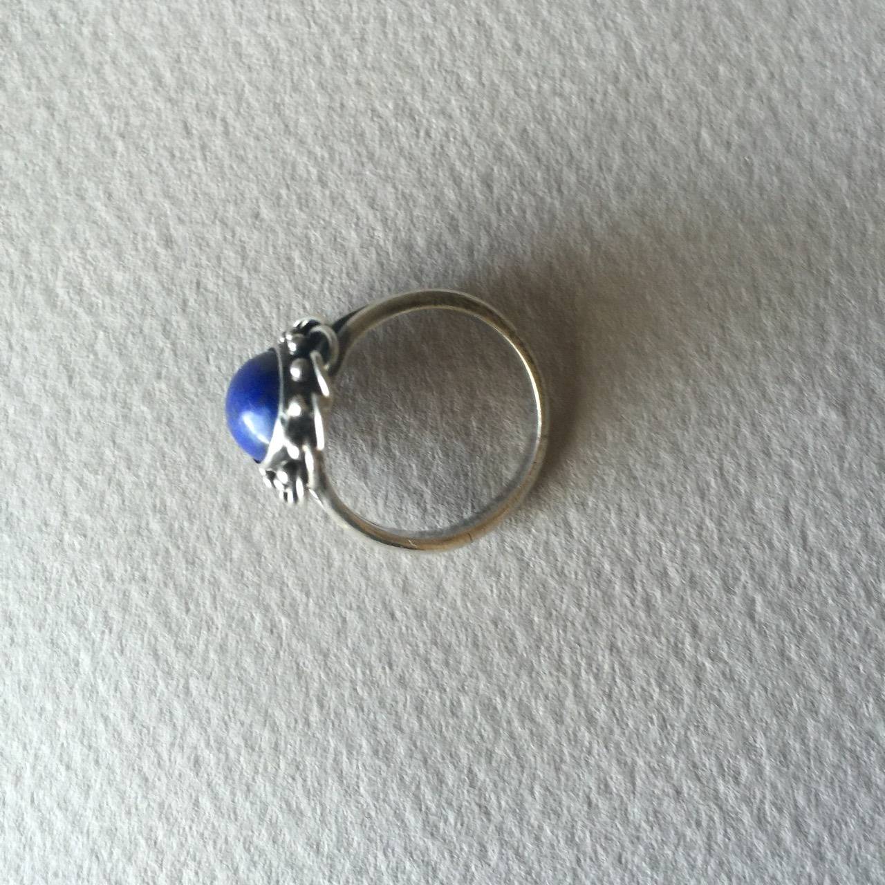 Georg Jensen Ring No. 26 with Lapis Lazuli.

This is an early example dates with 1920's hallmark and 830 silver. 

Very good vintage condition. Size 6.

Georg Jensen grew up in a small village Raadvad, 10 km north of Copenhagen. The close,