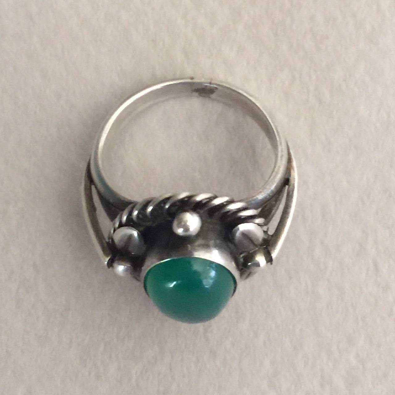 Georg Jensen Sterling Silver Ring No. 1 with Chrysoprase Cabochon.

Size 5. Post 1945 hallmarks. Very good condition.

Georg Jensen grew up in a small village Raadvad, 10 km north of Copenhagen. The close, daily contact with nature in this area