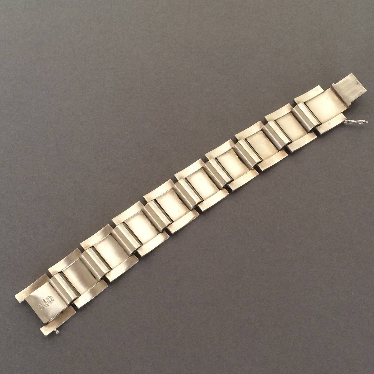 Georg Jensen Bracelet No 73 by Sigvard Bernadotte

Stunning curved solid segments hinged together beautifully. 

Measures 7