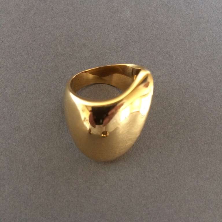 Georg Jensen 18K Ring No. 1091 by Nanna Ditzel 

Designed in 1956, this design is very rare to see in 18kt gold. Fully hallmarked from the period.  Size 6. Excellent condition

Matching bangle and earrings available.

Nanna Ditzel (1923 -