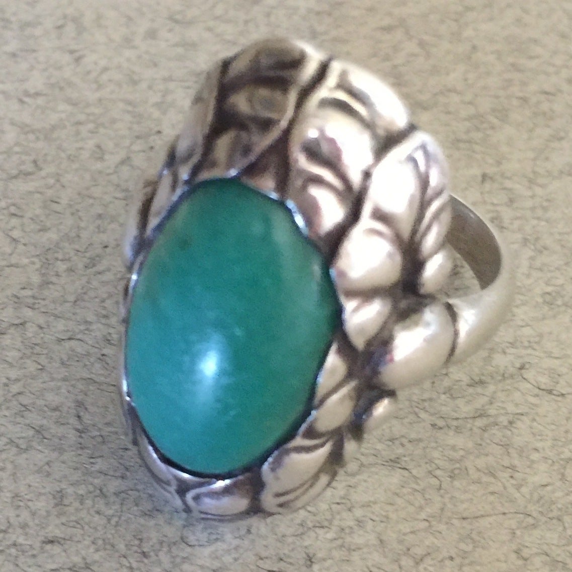 Georg Jensen Ring No. 11 with Amazonite

Wonderful large sterling silver ring that features a vibrant green Amazonite gemstone in the center of a leaf pattern setting. Rare to see in this large size and with Amazonite.

Size 8