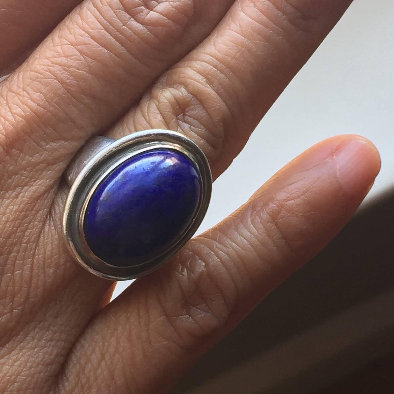 Georg Jensen Ring No. 46A with Lapis Lazuli by Harald Nielsen.

The gemstone has a deep, rich color. Stunning sterling silver ring in excellent condition.   Size 5

Yes, this ring can be re-sized.

Harald Nielsen bio: Harald Nielsen (1892 -