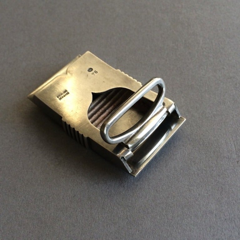 Georg Jensen Sterling Silver Belt Buckle No. 76 by Harald Nielsen. Very Rare.

A rare find.  Heavy gauge sterling silver.  Ingenius hinged pressure closure. Light surface scratches. Very good condition. Circa 1940's.

Matches with  Georg Jensen