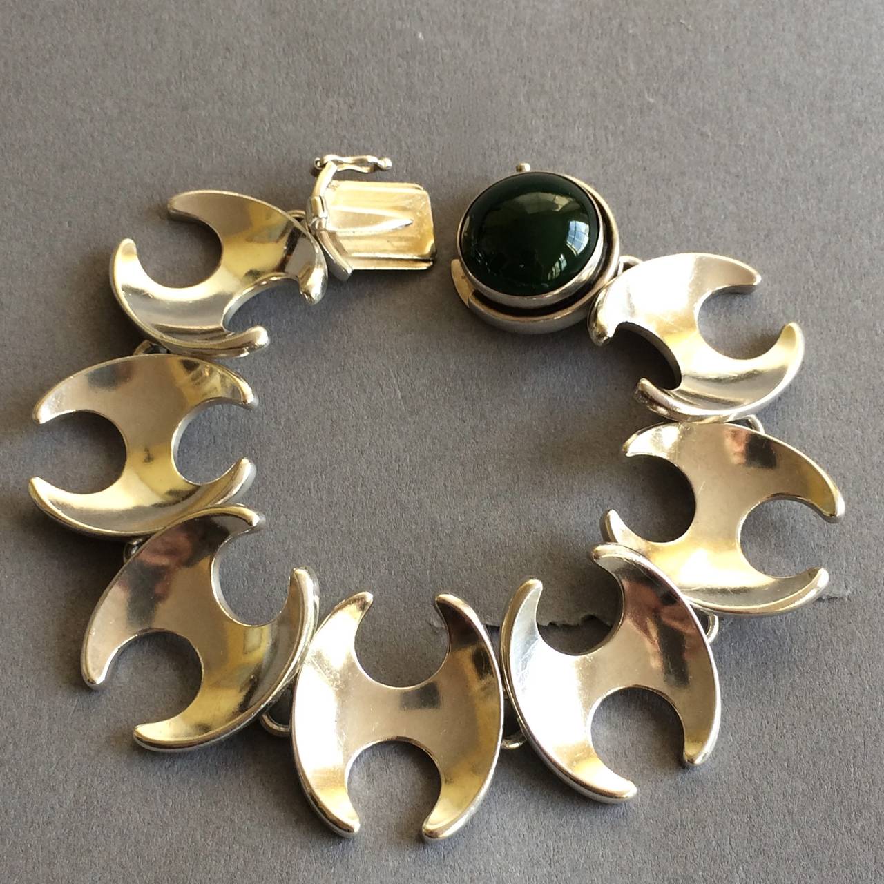 George Jensen bracelet with dark Jadeite Cabochon, no. 130 by Henning Koppel.

7.5