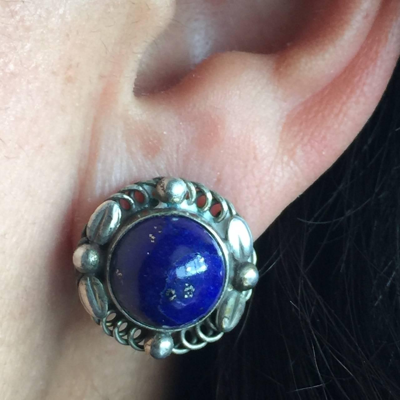 Georg Jensen Sterling Silver Earrings No. 39B with Lapis Lazuli

Classic Jensen design with a beautiful lapis lazuli stone. These are screw back but can be converted to omega back.

We have a ring in the same design in stock to compliment these