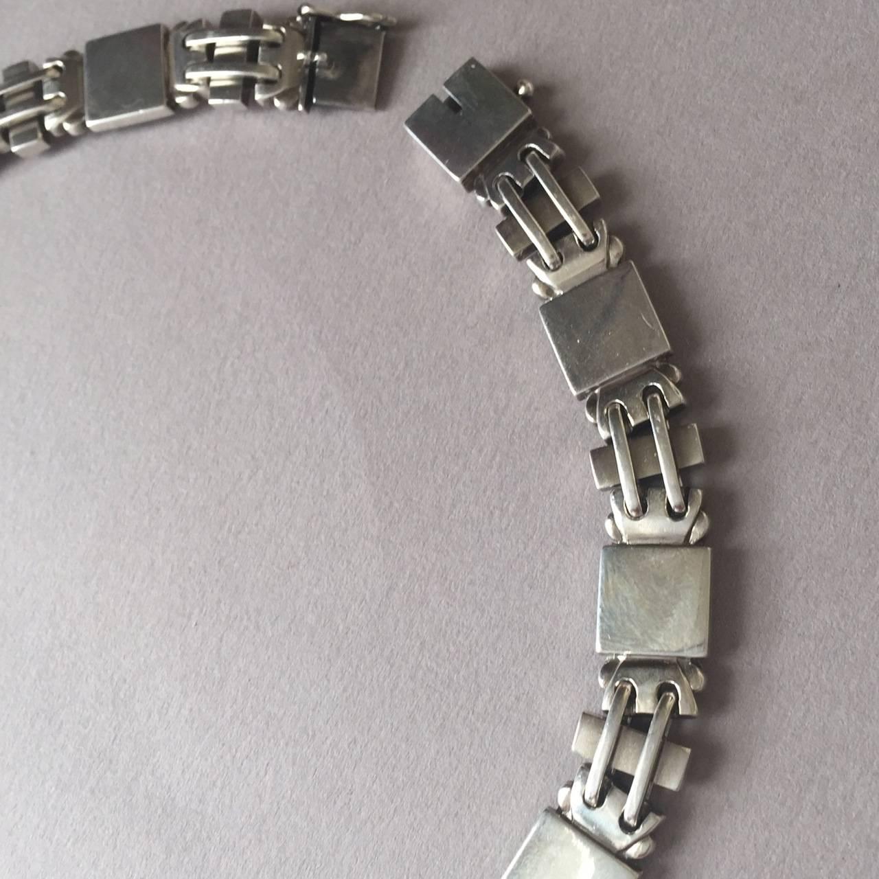 Georg Jensen Sterling Silver Art Deco Necklace No. 99 by Oscar Gundlach-Pedersen.  

Intricately detailed bracelet that is hard to find. Excellent condition with gorgeous patina.

We have the matching bracelet in stock.

Dimensons: 15.5