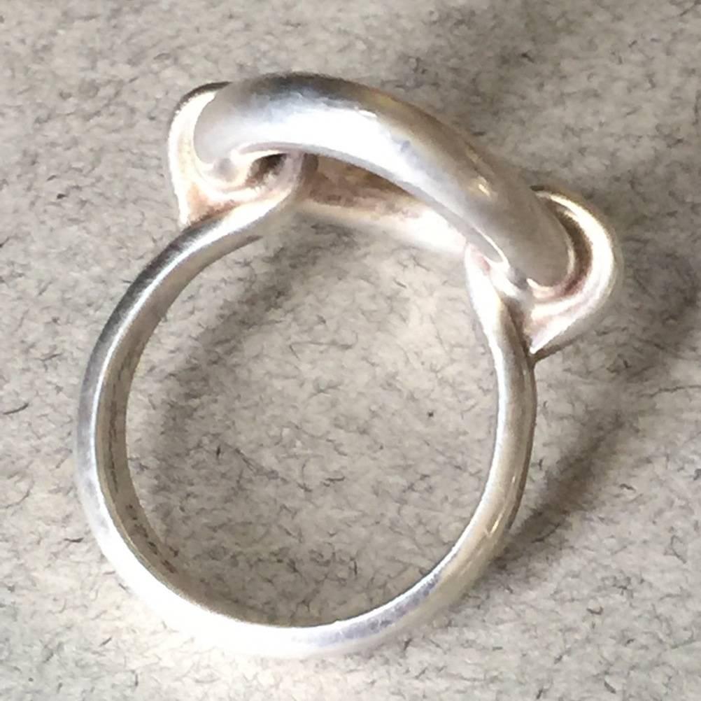 Hans Hansen Sterling Silver Modernist Oval Ring

This is a sterling silver oval ring with a simple, modernist design but with an overall big impact. The style incorporates an oval ring that connects to a graduating sterling silver band. The open