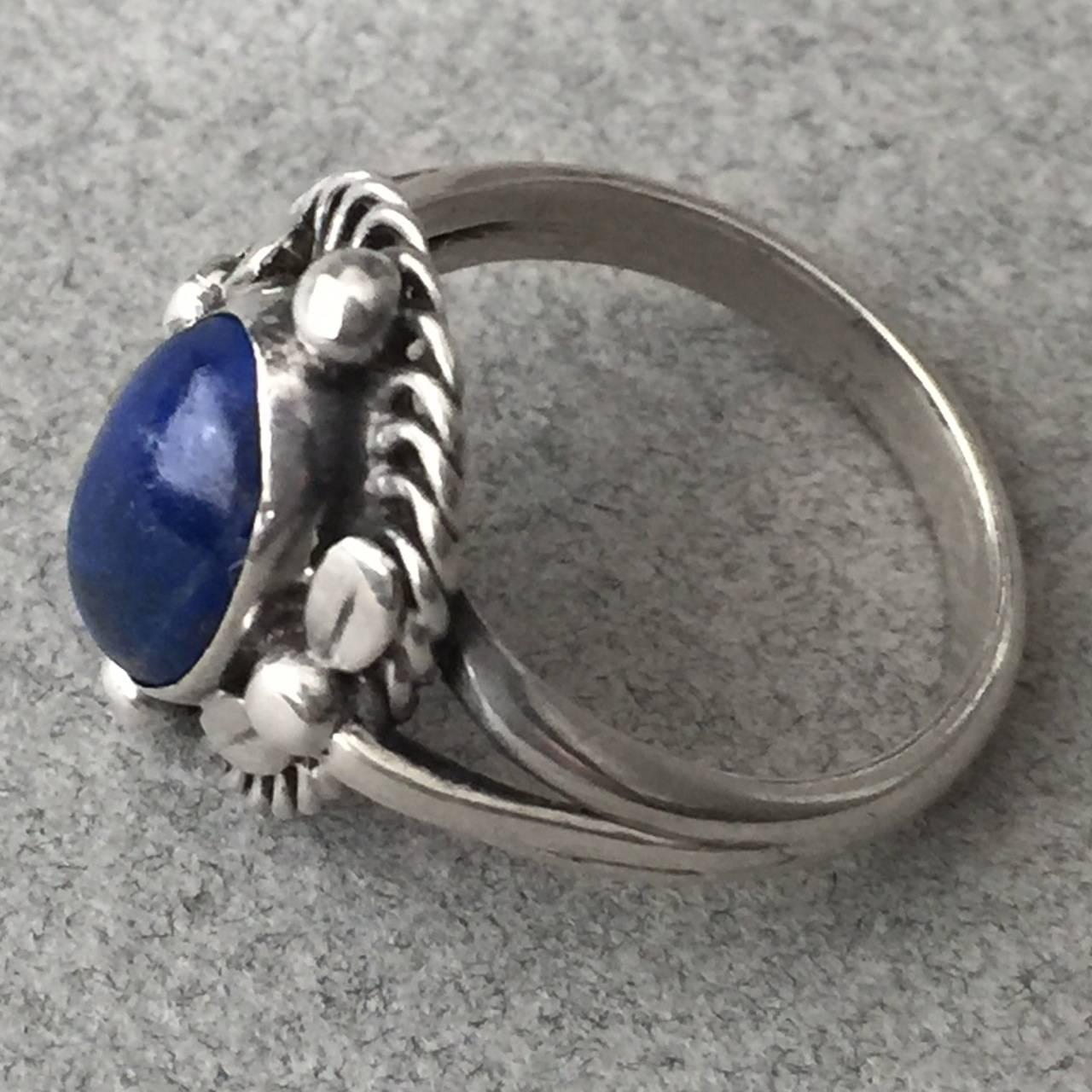 Georg Jensen 830 Silver Ring No. 1 with Lapis Lazuli.

Classic Jensen design with a beautiful lapis lazuli stone.This is the first ring that Georg Jensen designed.  Excellent condition with gorgeous patina.

Size 7.5