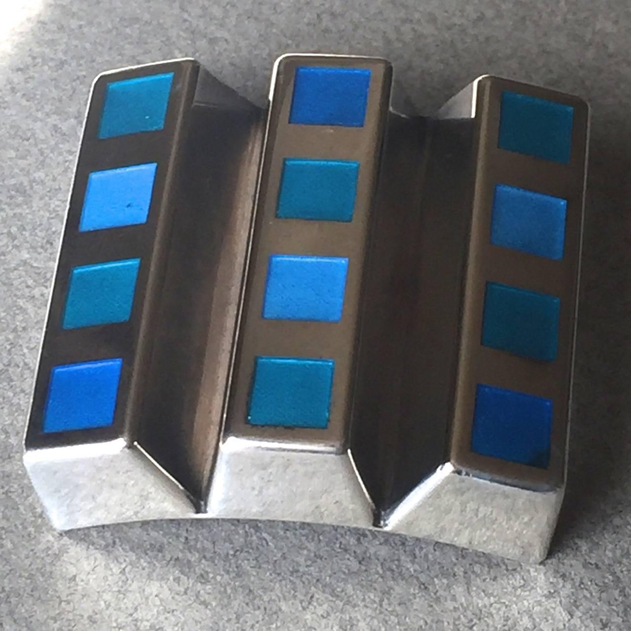Georg Jensen Sterling Silver Brooch No. 333B by Nanna Ditzel

Rare, enameled, large brooch set in sterling silver. The enamel is in varying shades of a vivid blue. 

This Danish Modern brooch is very hard to find and is in excellent