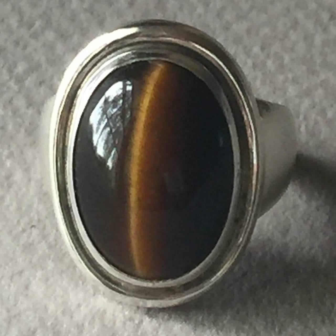 Georg Jensen Sterling Silver Tiger's Eye Ring No. 46A by Harald Nielsen

This ring is sure to impress. The tiger's eye is bright and gleams beautifully. Rare and hard to find with this stone. 

Size 7

Harald Nielsen bio: Harald Nielsen (1892