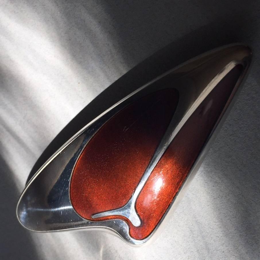 Georg Jensen Sterling Silver Brooch No. 314 by Henning Koppel

Sterling silver brooch with brown enamel inlay. Brooch is in good condition with one surface scratch that is barely detectable.
 
A similar example can be seen in the book, "GEORG