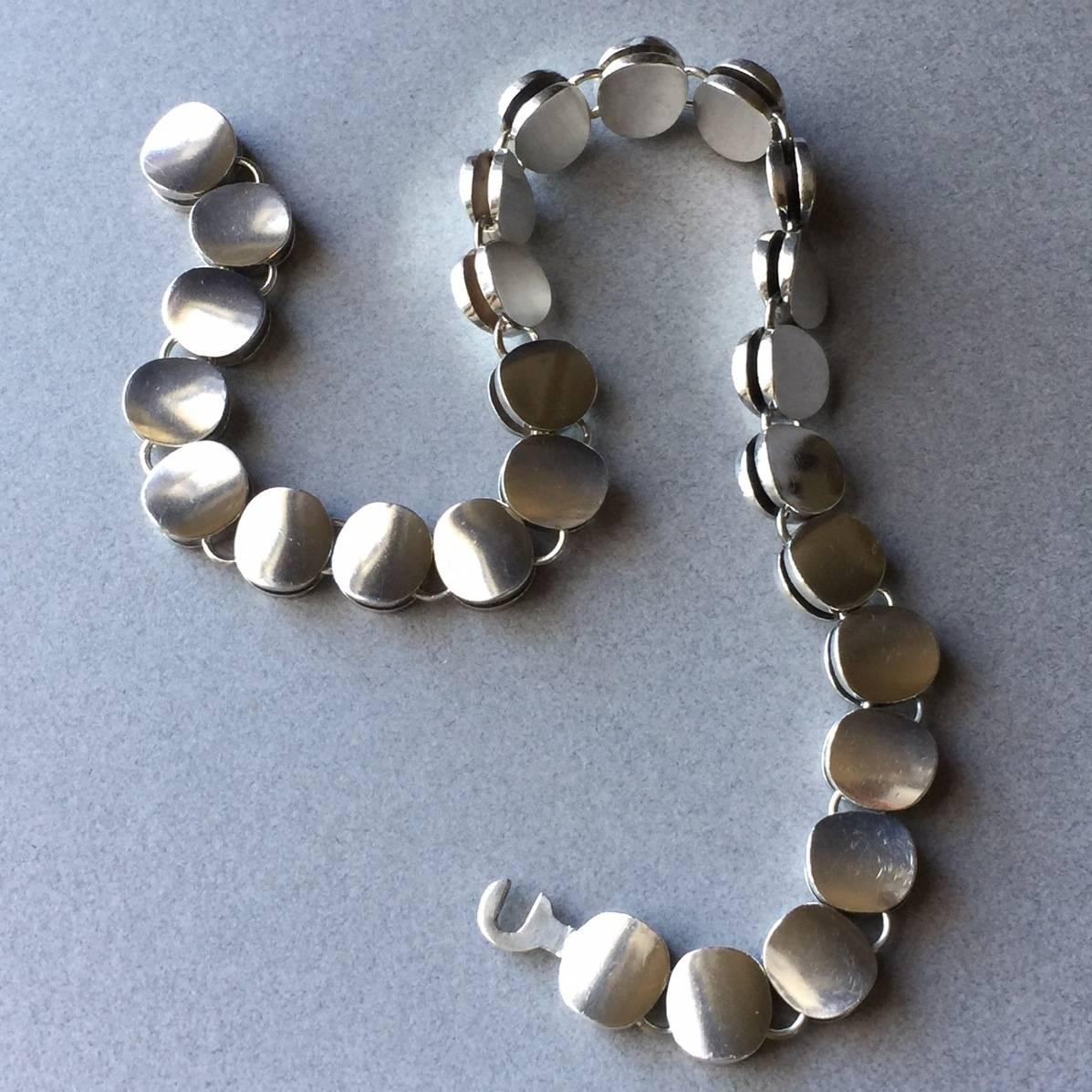 Georg Jensen Sterling Silver Modern Choker Necklace No. 124 by Nanna Ditzel

Stunning choker style, double disc necklace with toggle clasp. Very heavy. Excellent condition. 

Complimentary gift box and FREE shipping included.

About the