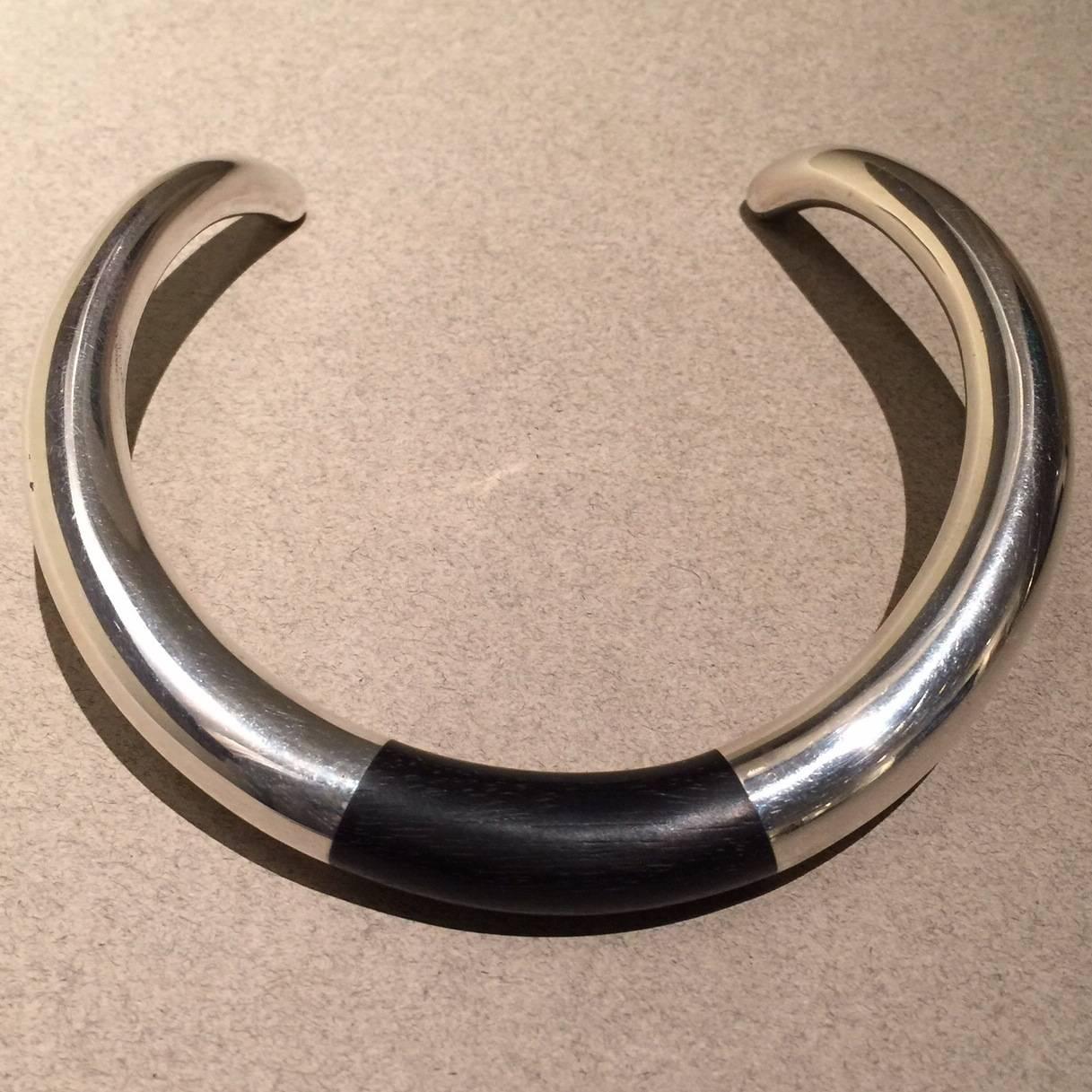 Georg Jensen Sterling Silver and Ebony Neck Ring No. A29A by Anne Ammitzbøll

Fabulous vintage piece from 1978. Bold, modern design. Neck ring is in excellent condition.

Please note that this piece is for a person with a petite neck. 

Dimensions: