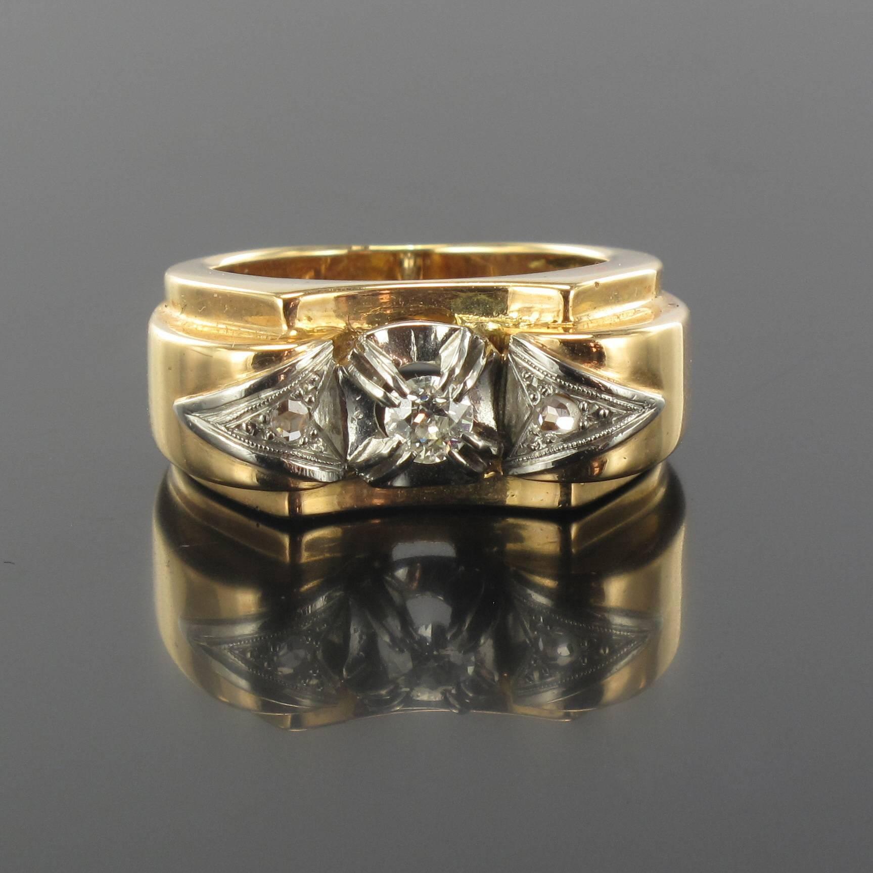Ring in 18 carat yellow and white golds, eagle head hallmark. 

This splendid diamond tank ring in the form of a bridge features a central claw set brilliant cut diamond. On each side is a triangular design set with a rose cut diamond. 

Width: