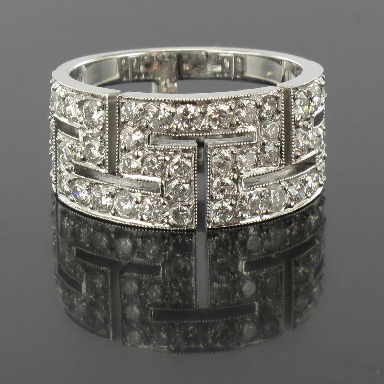 Ring in 18 carat white gold, eagle head hallmark. 

Composed of a double flat band with the front portraying a geometric design set with brilliant cut diamonds. 

Total weight of diamonds: 1.47 carats approximately.
Height: 1.7 cm, ring base