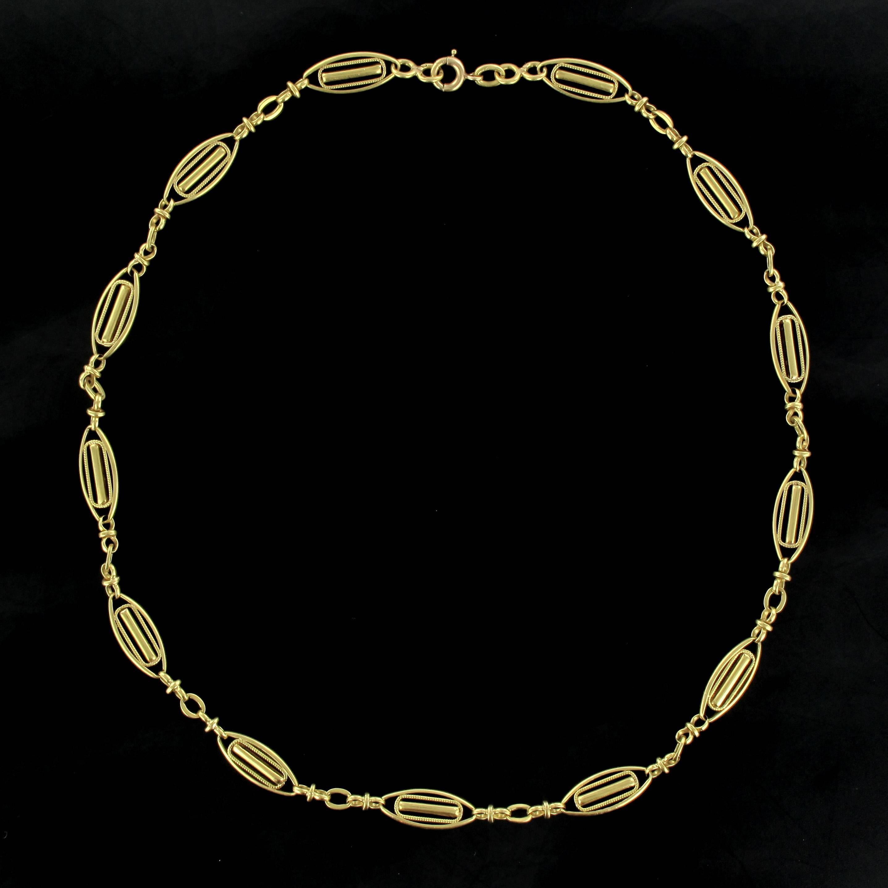 Necklace in 18 carat yellow gold, eagle head hallmark. 

Composed of 13 openwork marquise shaped motifs separated by gold rings. This necklace features a spring ring clasp. 

Total length: 40.4 cm, motives dimensions: Length: 1.65 cm, width: 7.5
