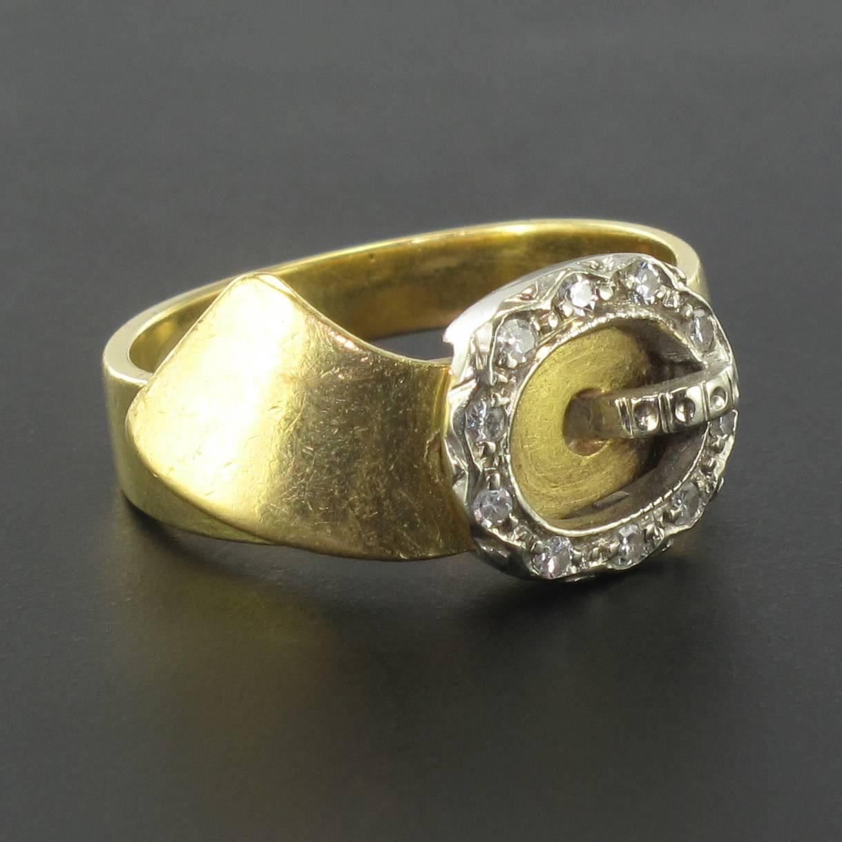 Ring in 18 carat yellow gold, eagle head hallmark. 

This ring is in the form of a belt with the pin and buckle set with diamonds. 
Original and highly symbolic representing the theme of ‘attachment’, this is a highly appealing ring. 

Total