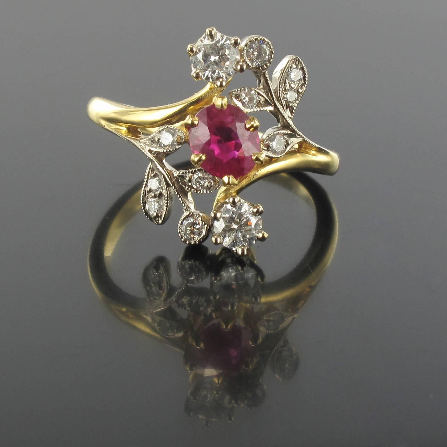 Ring in 18 carat yellow gold, eagle head hallmark. 

This ring features a claw set oval red ruby surrounded by a floral design with a diamond pave. 

Ruby Weight: 0.72 carat approximately
Total diamond weight: 0.46 carat approximately
Total