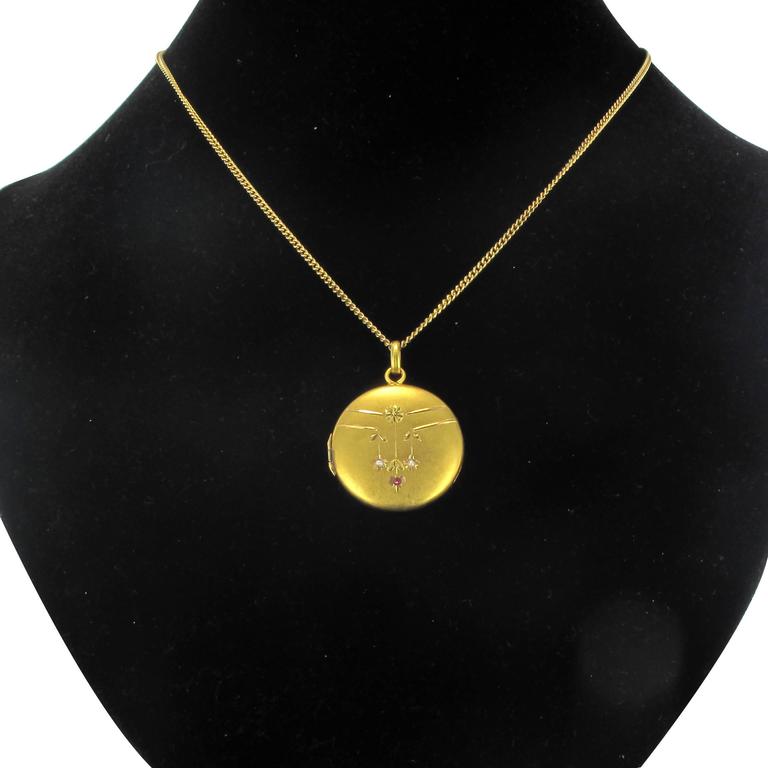1900s Satin Gold Ruby and Fine pearl Medallion Locket Pendant at