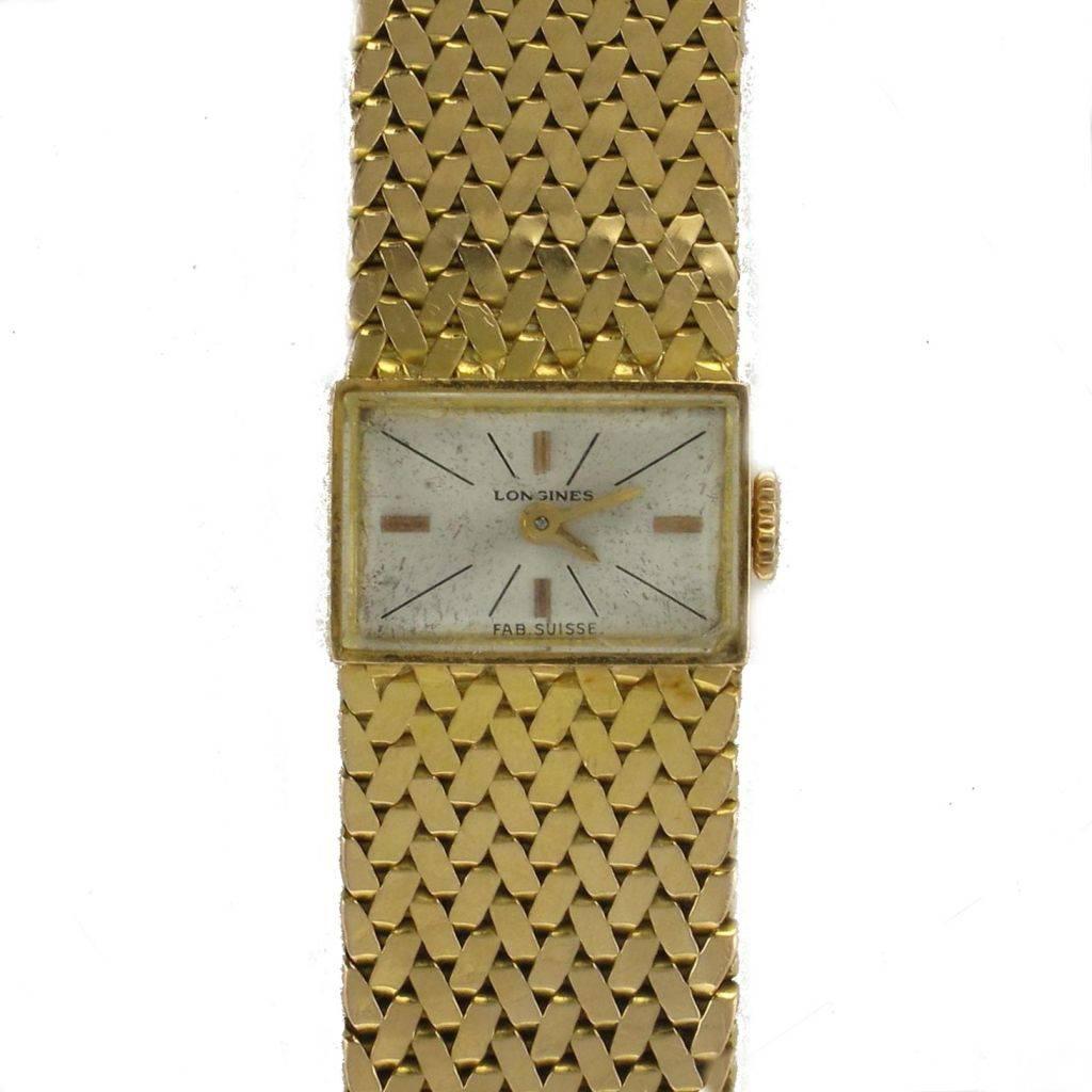 Longines Women's watch
Bracelet and Rectangular case in 18 carats yellow gold, eagle head hallmark.
Revised and controlled watch - Very good condition and general appearance.
Mechanical watch with manual winding.
Cream background.
Vintage watch from