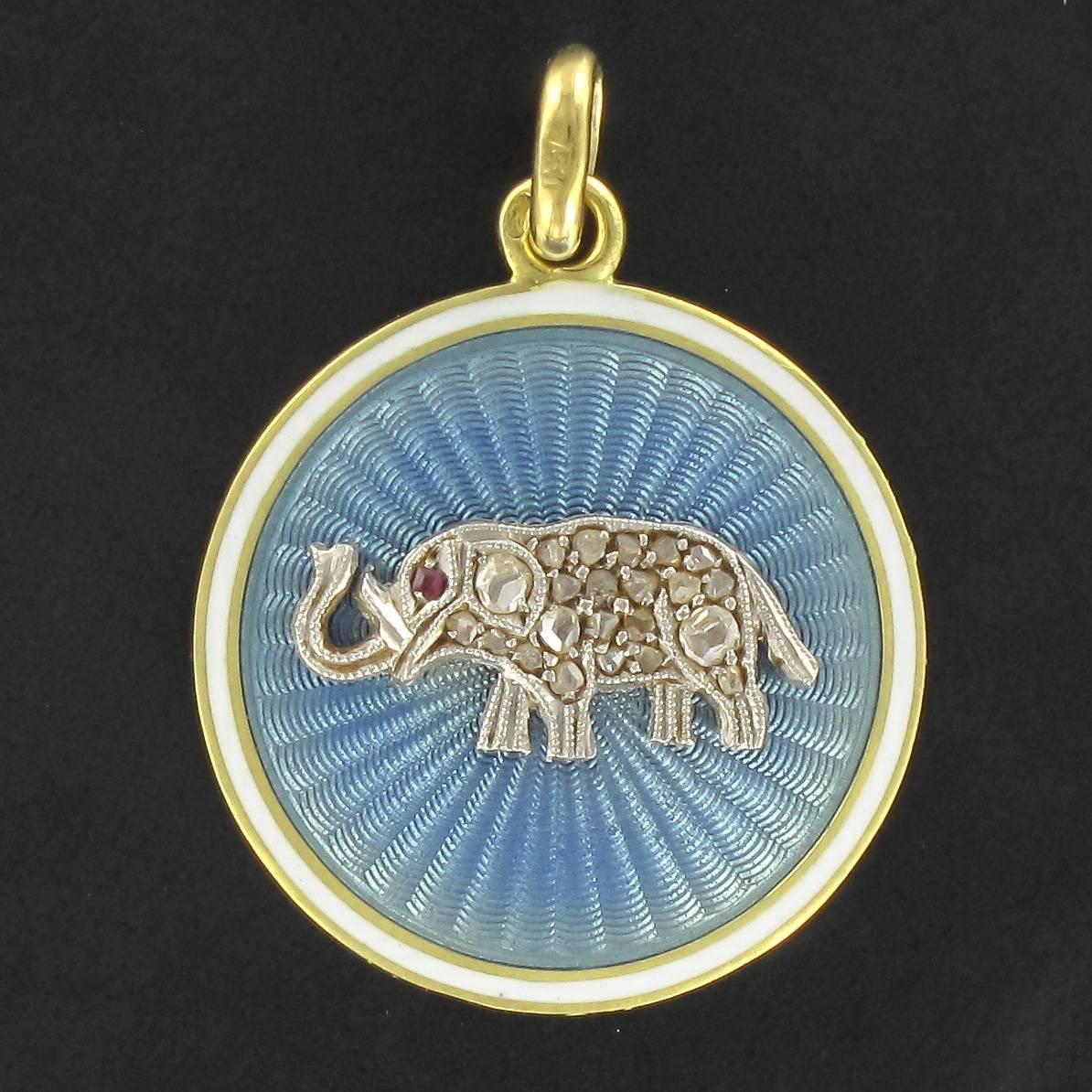 Medal in 18 carat yellow gold, eagle head hallmark. 
This delightful rare antique medallion features an elephant theme design in blue and white enamel set with rose cut diamonds. The back is smooth. 
This magnificent antique pendant is in excellent