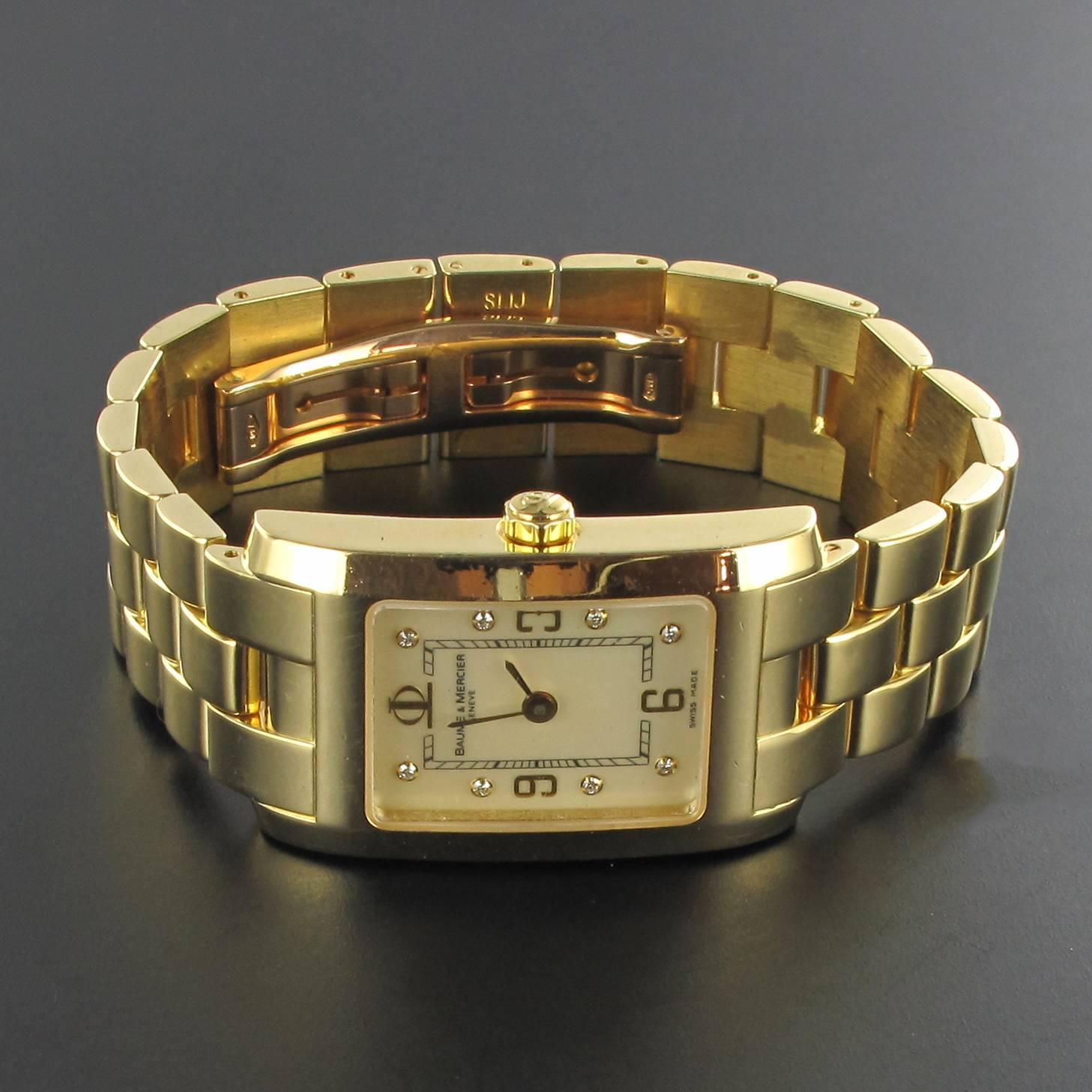 Women's watch in 18 carat yellow gold.
Model Hampton by Baume & Mercier.
Rectangular case and bracelet 18 carats yellow gold.
Weight: 63.3 g approximately.
Numbered 3673040
Mother-of-pearl set with 8 diamonds.
Clasp with double clasp.
Quartz watch -