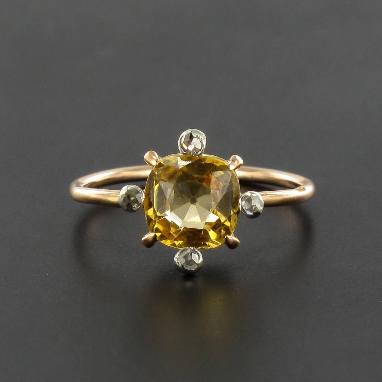 Ring in 18 carat yellow gold, eagle head hallmark. 
This gorgeous antique ring is claw set with a cushion cut topaze with rose cut bezel set diamonds at each corner. 
Total weight of the topaz: about 0.90 carat.
Height: 9.87 mm, width: 9.83 mm,