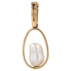 Colgante de oro amarillo de 18 quilates con perla barroca de los años 60