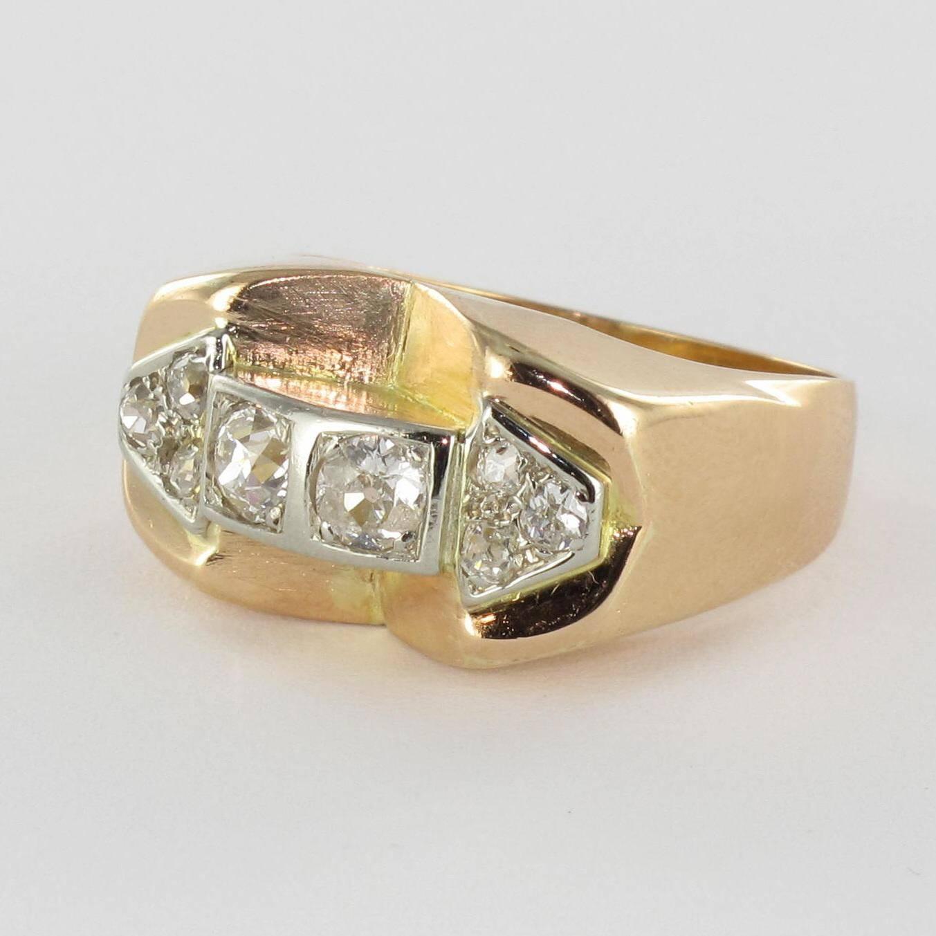 Ring in 18 carat yellow gold. 

A bridge ring, set with 2 antique brilliant cut diamonds on a square bed shouldered by 2 x 3 antique brilliant cut diamonds in triangular designs. 

Total diamond weight: about 0.80 carat.
Height: 12 mm, Width: